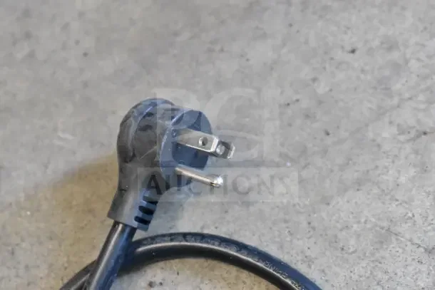 Close-up of a power plug for True TSCI-600R-G-PH cooler merchandiser, showcasing a standard 115V, 1 phase connection.
