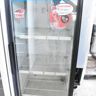 True GDM-12 single door commercial cooler, 115V, 1 phase, glass door, shelves, live bait decals, black trim.