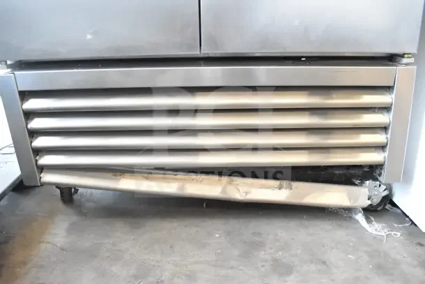 2017 True T-35 commercial 2-door reach-in cooler, 115 volts, 1 phase. Visible dent on lower vent, on wheels, stainless steel finish.