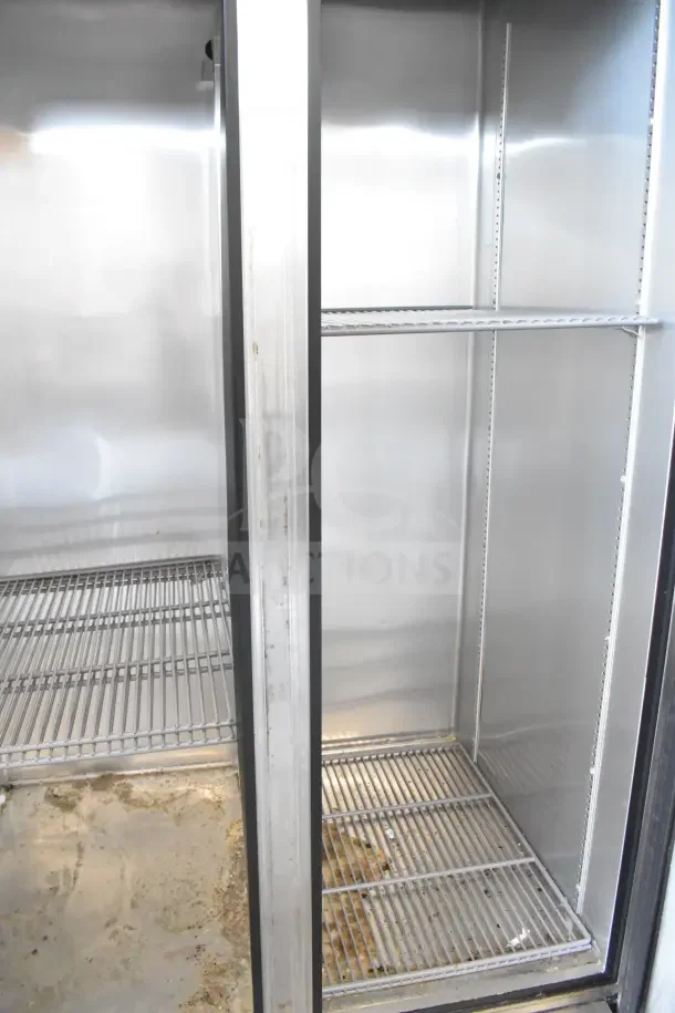 2017 True T-35 commercial 2-door reach-in cooler, 115 volts, 1 phase, showing interior shelves, used condition.