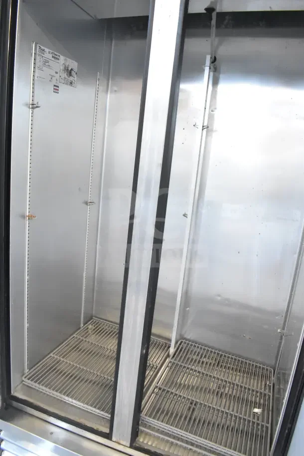 2016 True T-35 Commercial 2 Door Reach-In Cooler, on casters, 115V, 1 Phase, stainless interior, model label visible.