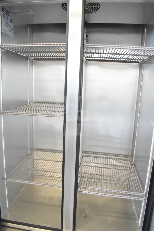 2018 True T-35 Commercial 2 Door Reach-In Cooler with shelves, on casters, 115 volts, 1 phase, excellent condition.