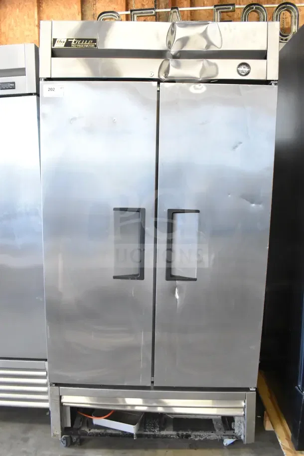 2016 True T-35 commercial 2-door reach-in cooler, stainless steel, with commercial casters. 115 volts, 1 phase. Moderate wear.