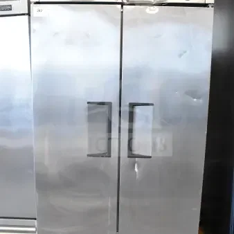 2016 True T-35 commercial 2-door reach-in cooler, stainless steel, with commercial casters. 115 volts, 1 phase. Moderate wear.