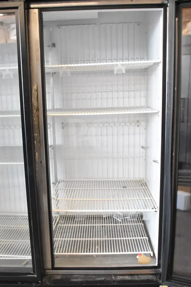 2018 True GDM-72F-HC commercial 3-door reach-in freezer, 115 volts, 1 phase, features wire shelving, visible wear.