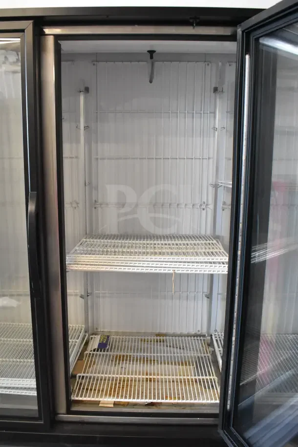 2018 True GDM-72F-HC commercial 3-door reach-in freezer, 115/208-230V, 1-phase, clean interior, sturdy wire shelves.