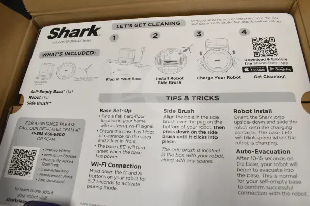 IN ORIGINAL BOX! Shark Navigator Robot Vacuum instructions detailing setup, features, and QR codes for app download.