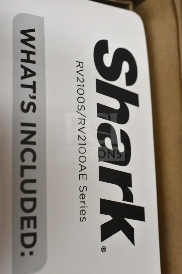 Shark Navigator Robot Vacuum RV2100S/RV2100AE Series, in original box, includes manual and accessories.