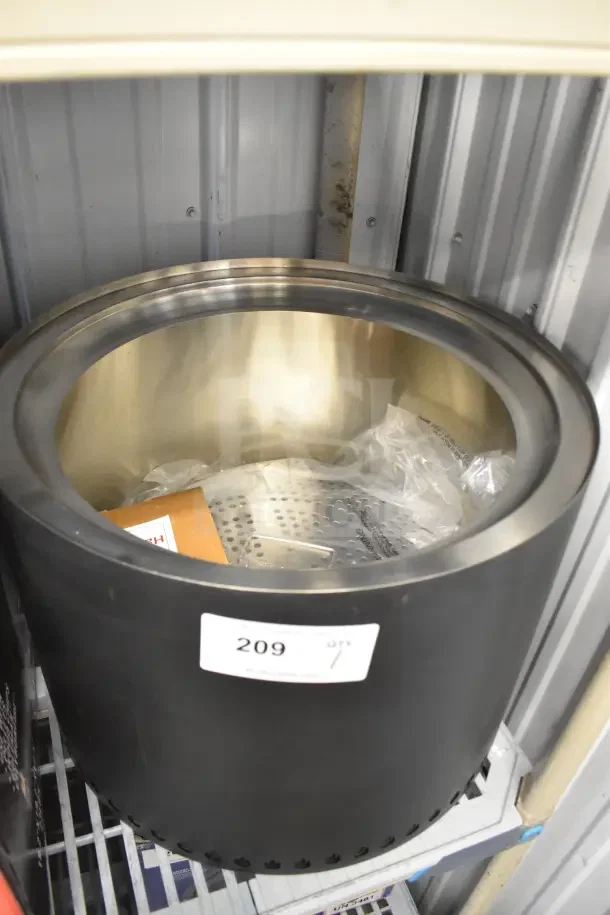 Coleman CCS-200 Portable Smokeless Fire Pit, black with stainless steel interior. Tag reads "209". In excellent condition.