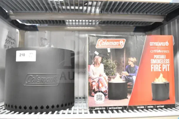 2 Coleman CCS-150 Portable Smokeless Fire Pits, matte black, with original packaging. Auction lot tag shows 210 QTY x2.
