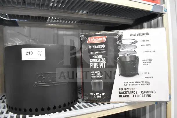 Coleman CCS-150 Portable Smokeless Fire Pit in box, includes fire ring, ash grate, catch pan, feet, carry case, new condition.