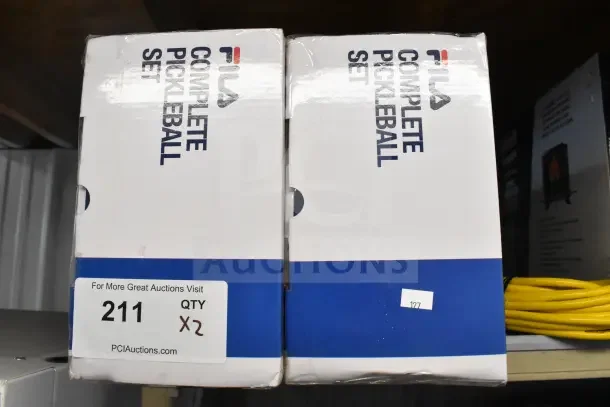 Brand new Fila Complete Pickleball Set in box, quantity two. Auction tag indicates lot number 211, bid multiplier x2.