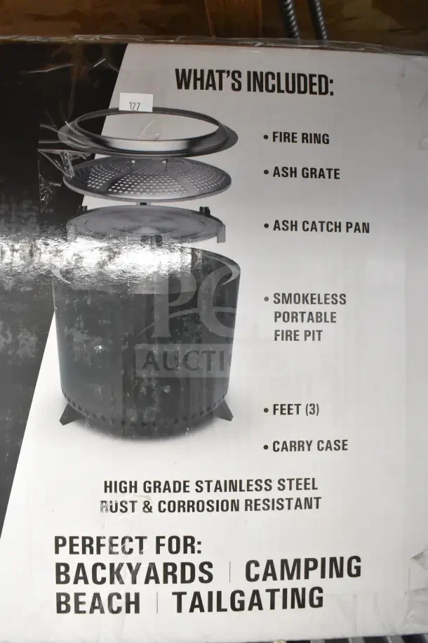 Brand new Coleman CCS-150 smokeless fire pit in box. Includes fire ring, ash grate, catch pan, three feet, carry case.