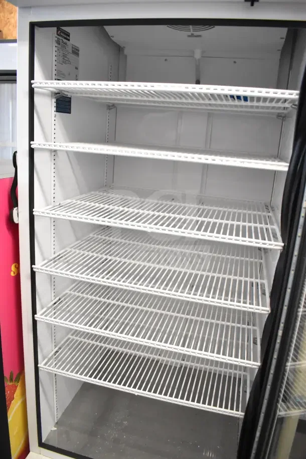 2021 True TSCI-600R-G-PH single door reach-in cooler, features glass door, five wire shelves, 115 volts, excellent condition.
