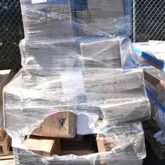 Palette of 26 new scratch and dent items, including bar mat, airpot, and glasses, wrapped in plastic. Boxes labeled.