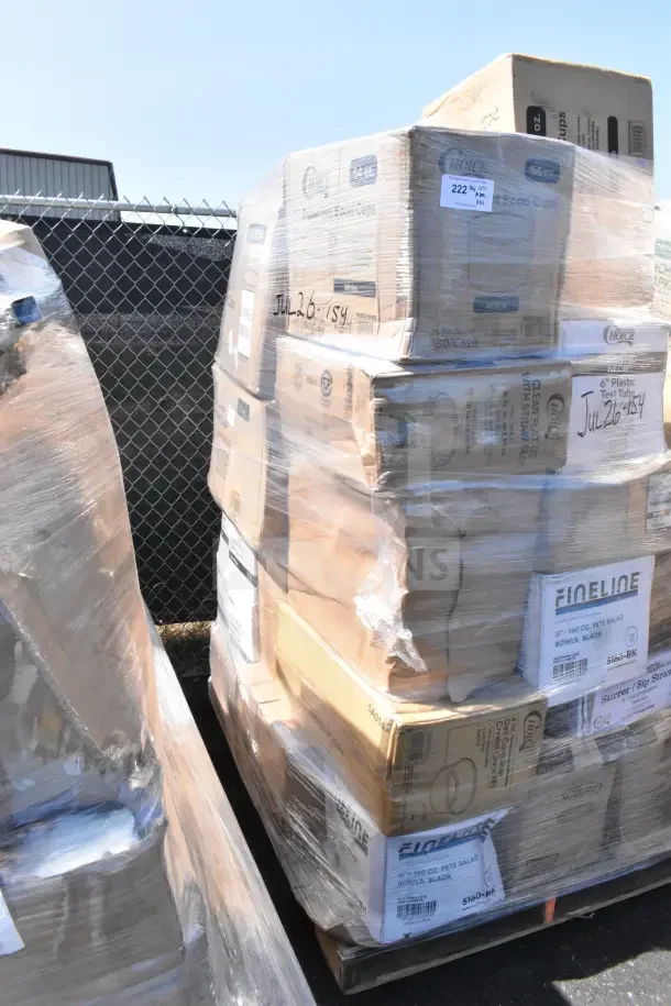 Pallet of assorted brand new scratch and dent items including plastic bowls and cold cups in cardboard boxes wrapped in plastic. Labels visible.
