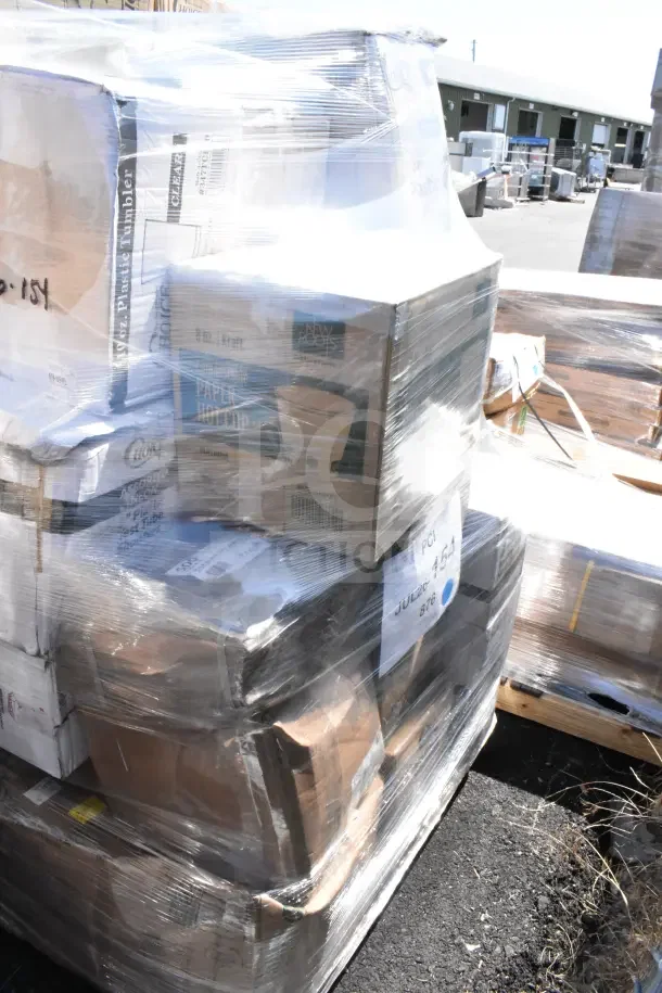 31 scratch and dent items including plastic bowls, cold cups, bowls, and paper bags. Wrapped in plastic on a pallet.