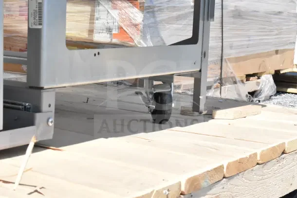 Structural Oasis MI48R Commercial Horizontal Cooler on platform, visible caster wheels, label on frame, condition appears used.