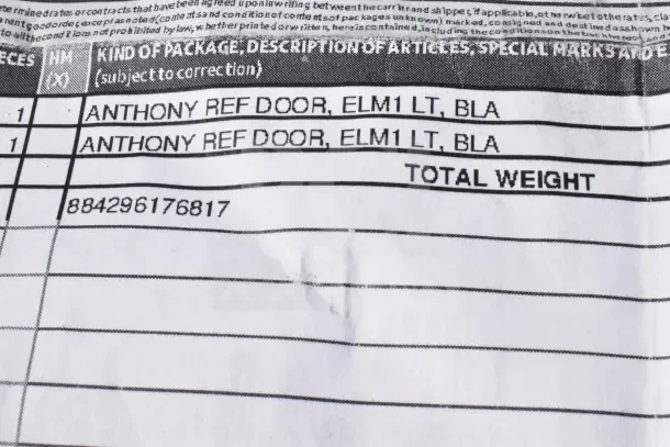 Label showing "Anthony Refrigerator Door, ELM1 LT, BLA", indicating model and color details for the auction item.