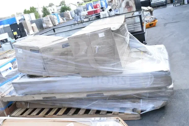 Shrink-wrapped pallet containing 8 new scratch and dent items, including ingredient bins and a work table, in original boxes.
