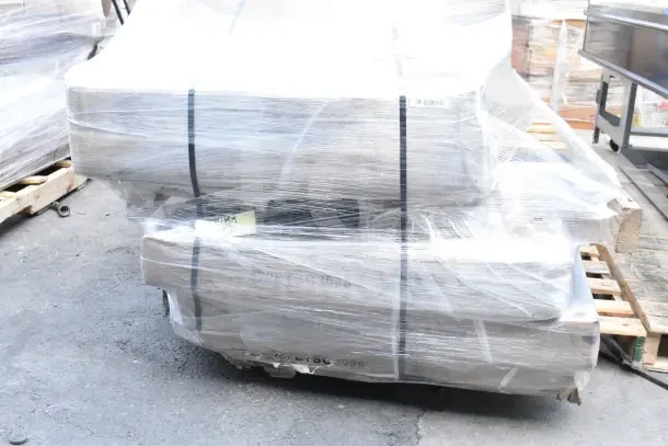 Packaged set of 8 new scratch and dent items, including ingredient bins and work table, wrapped in plastic on a pallet.