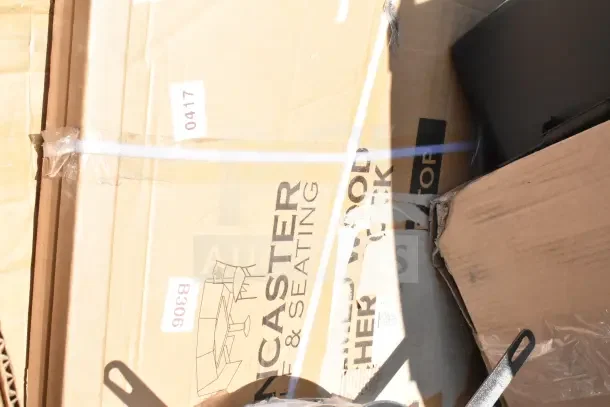 Boxes labeled "Lancaster Table & Seating," showing scratch and dent items including stool, sink, and trash can.