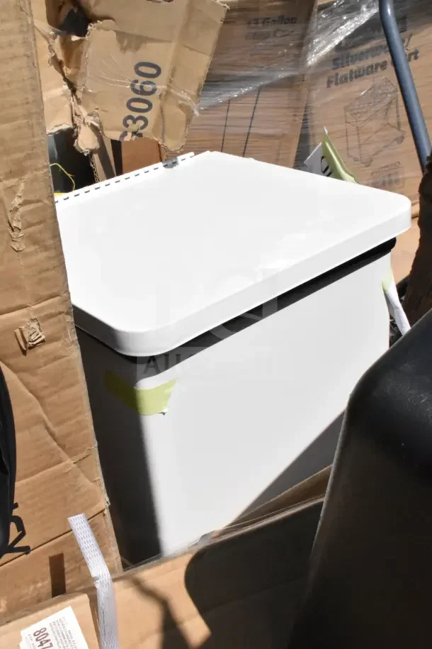 10 scratch and dent items, new; image shows white trash can amidst cardboard boxes. Mixed condition, taped edges.