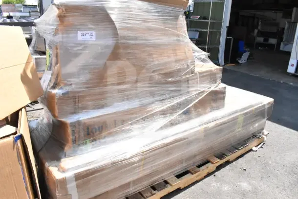 Stacked pallet of six brand new, scratch and dent items, including chairs, a work table, and a housekeeping cart, wrapped in clear plastic.