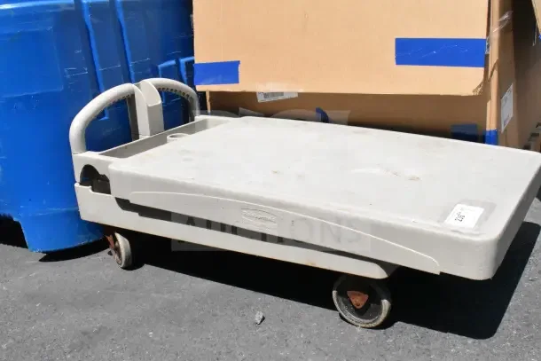 Rubbermaid 2 Tier Cart, grey, single tier visible, missing pieces, worn condition, with Rubbermaid logo on side.