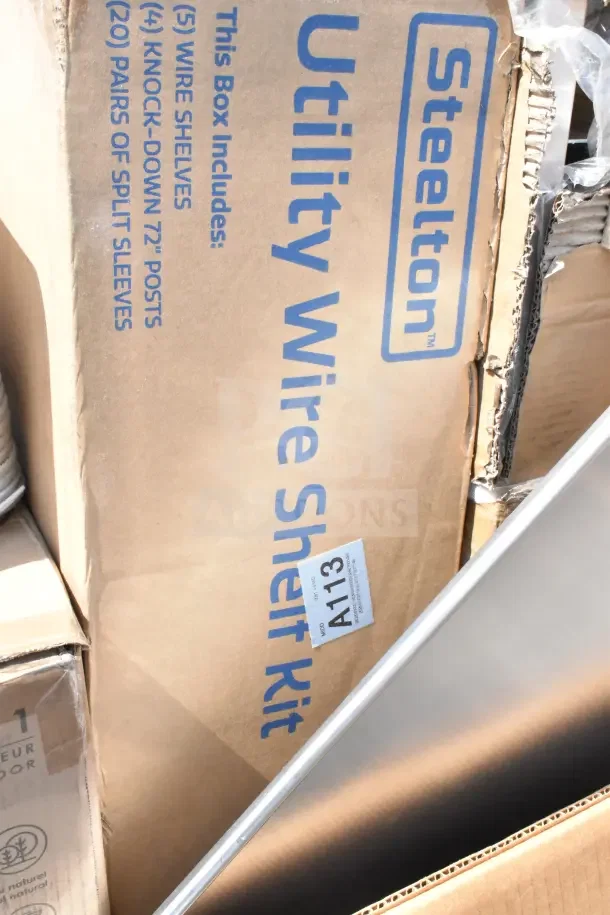 Boxes of Steelton Utility Wire Shelf Kits, marked with label A113, show storage items for auction, some with scratches or dents.
