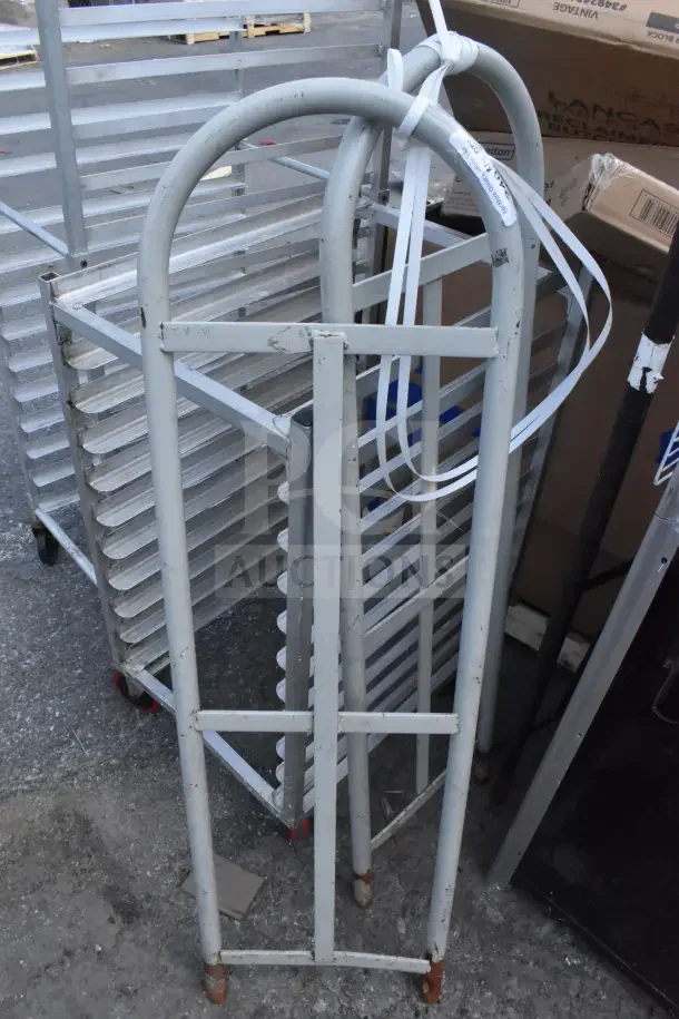 Three gray metal handles for furniture dolly, slightly rusted, bundled with white straps. Condition: used.