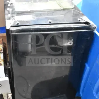 Mini black cooler, 115 volts, 1 phase. Features sturdy construction, minor surface wear. Ideal for compact storage.