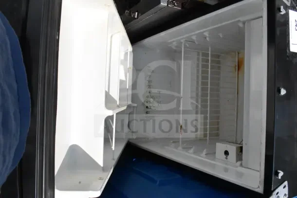 Mini Cooler, 115 Volts, 1 Phase, interior view with wire shelves, moderate wear and rust spots inside.
