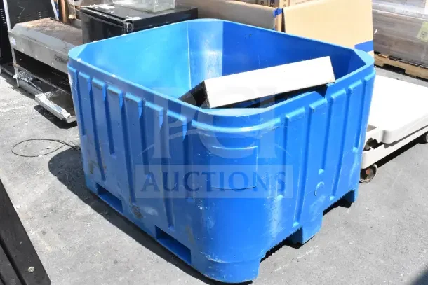 Blue poly bin in fair condition, large capacity, visible scratches, suitable for storage or transportation.