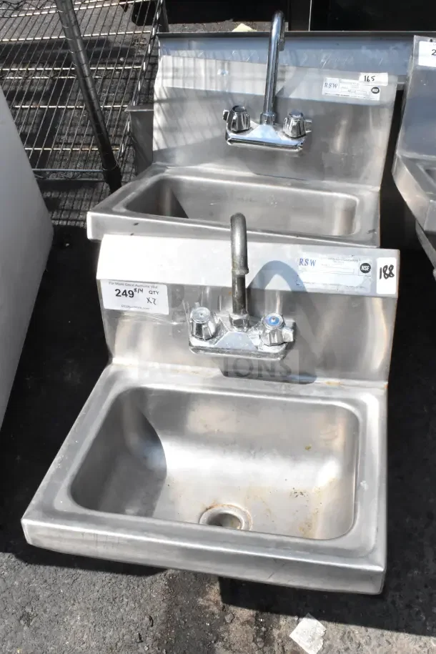 Two commercial single bay wall mount sinks with faucets and handles, stainless steel, visible labels indicating model and quantity.