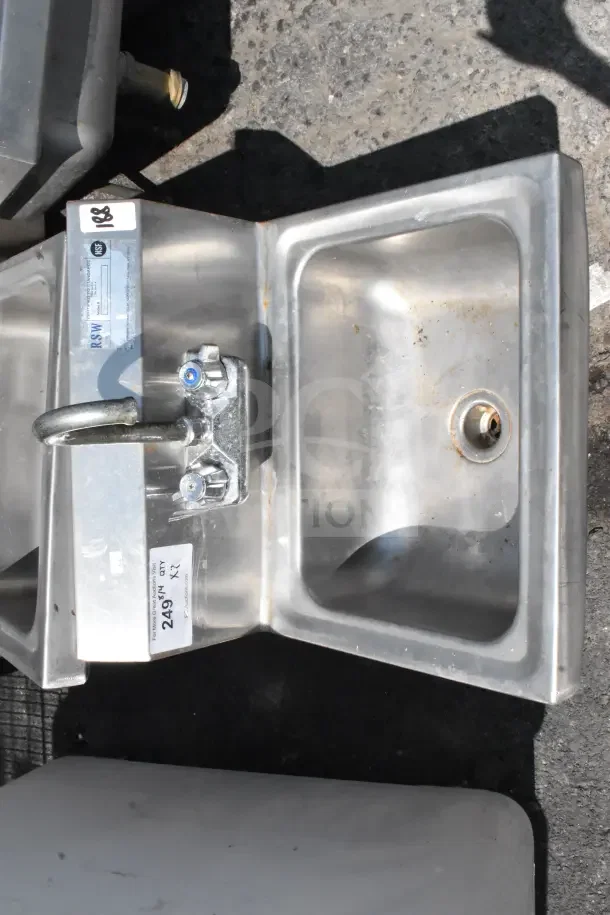 Commercial single bay wall mount sink with faucet, handles, NSF certified. Visible signs of wear, labeled Lot 249.