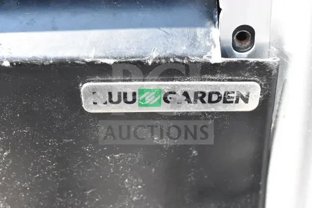 Nuu Garden Outdoor Propane Gas Heater, visible brand logo on black and metal surface, showing usage wear.