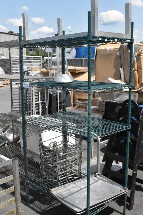 Four-tier wire shelving unit in green finish with baking pans and dunnage rack. Buyer to dismantle for shipping.