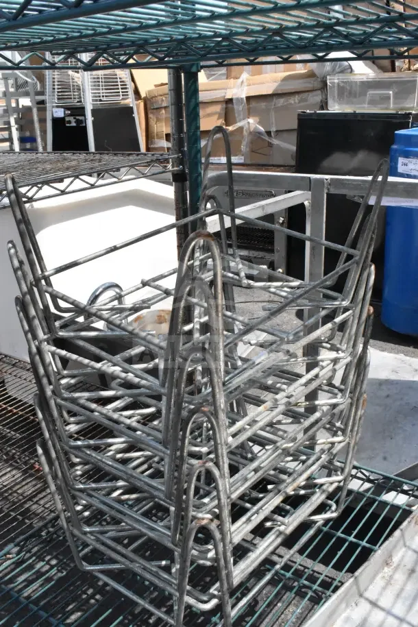 Green finish 4-tier wire shelving with baking pans and dunnage rack. Buyer must dismantle. Consider freight charges.