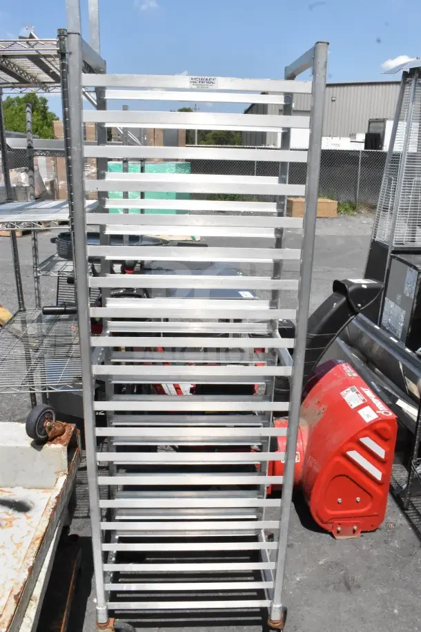Newage Commercial Pan Transport Rack with 18 slots, on durable commercial casters, made of aluminum, in excellent condition.