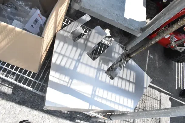 Chrome finish 3-tier wire shelving unit with contents, including lid organizer. Requires buyer dismantle.