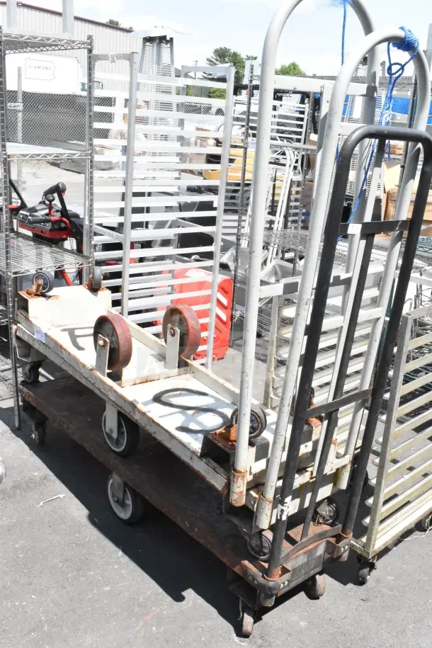 Three U-Boat carts on commercial casters, showing some rust. Ideal for warehouse or commercial use.