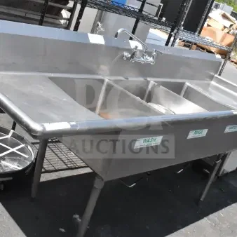 Stainless steel commercial 3 bay sink with dual drain boards, labels for wash, rinse, sanitize, in good condition.