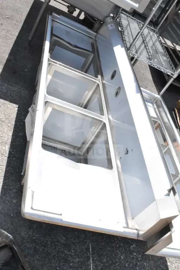 "Steelton 522CS31014LR 54-inch three compartment commercial sink, brand new scratch and dent, two 12-inch drainboards, no legs."
