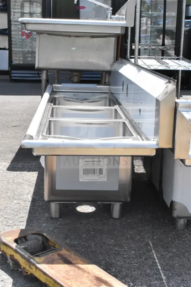 Brand new Steelton 54" three-compartment sink with two 12" drainboards. Scratch and dent condition, no legs.