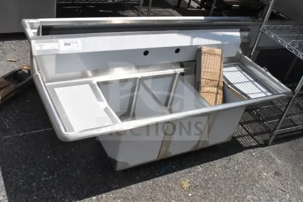 Brand new Steelton 522CS31014LR 54" three compartment sink with two 12" drainboards. Scratch and dent condition.