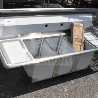 Brand new Steelton 522CS31014LR 54" three compartment sink with two 12" drainboards. Scratch and dent condition.