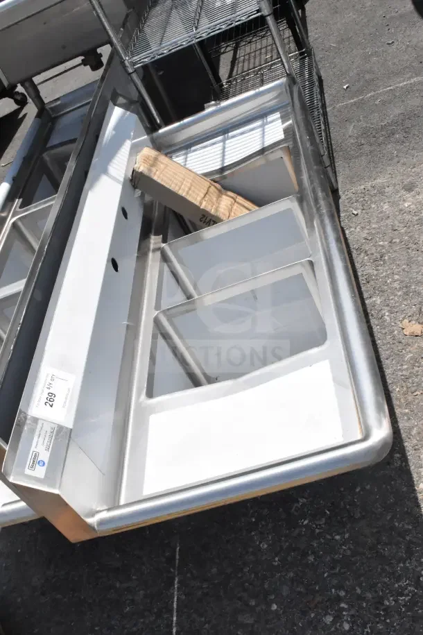 Alt text: Steelton 54" three-compartment commercial sink with two 12" drainboards, brand new scratch and dent condition.