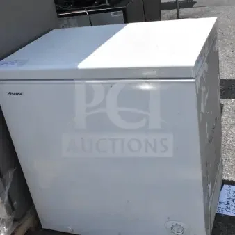 Hisense chest freezer, 115 volts, 1 phase, white exterior, visible wear, model tag attached, suitable for extra storage.