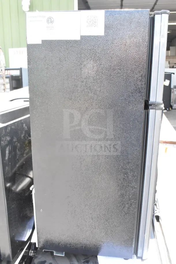 4 mini coolers, including Galanz and Haier models, 120 volts, 1 phase. Textured black exterior, minor wear.